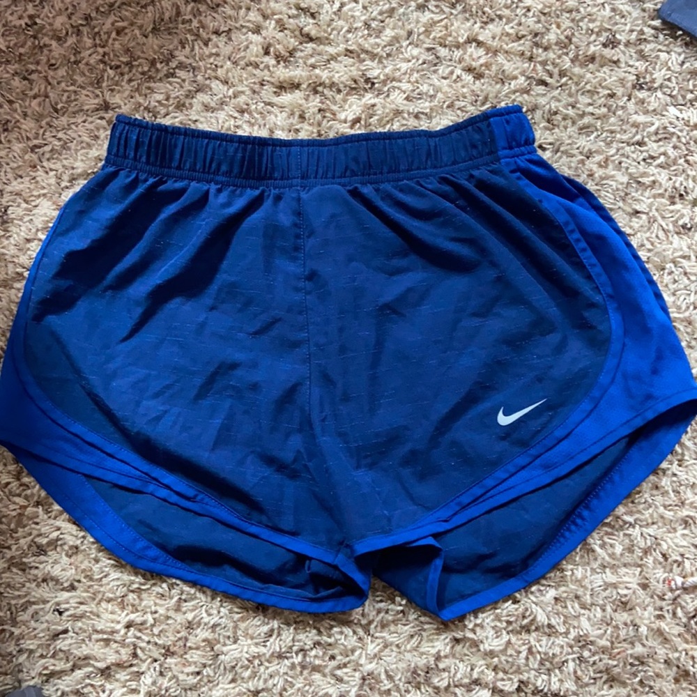 Blue Nike track shorts